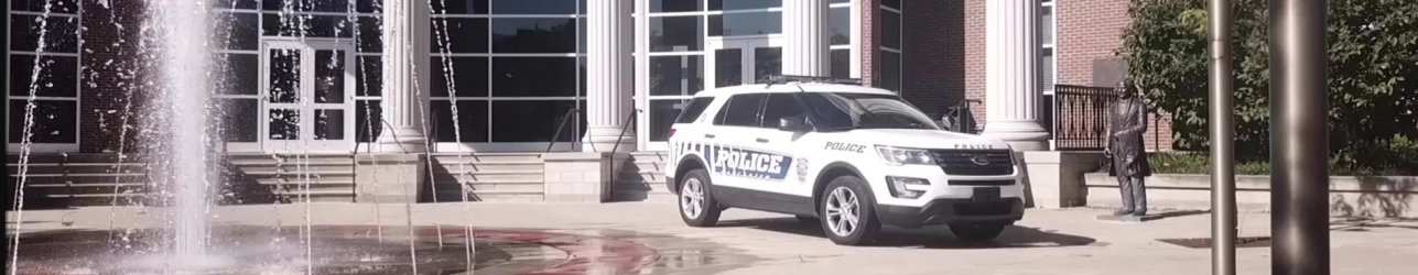 Lancaster Police vehicle in front of building